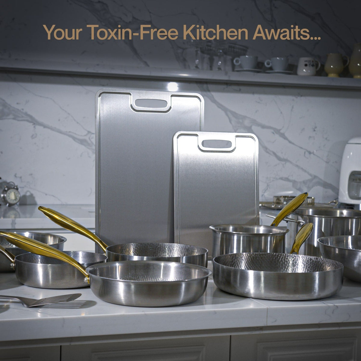 Titanium cookware set on a kitchen counter with text 'Your Toxin-Free Kitchen Awaits...'.
